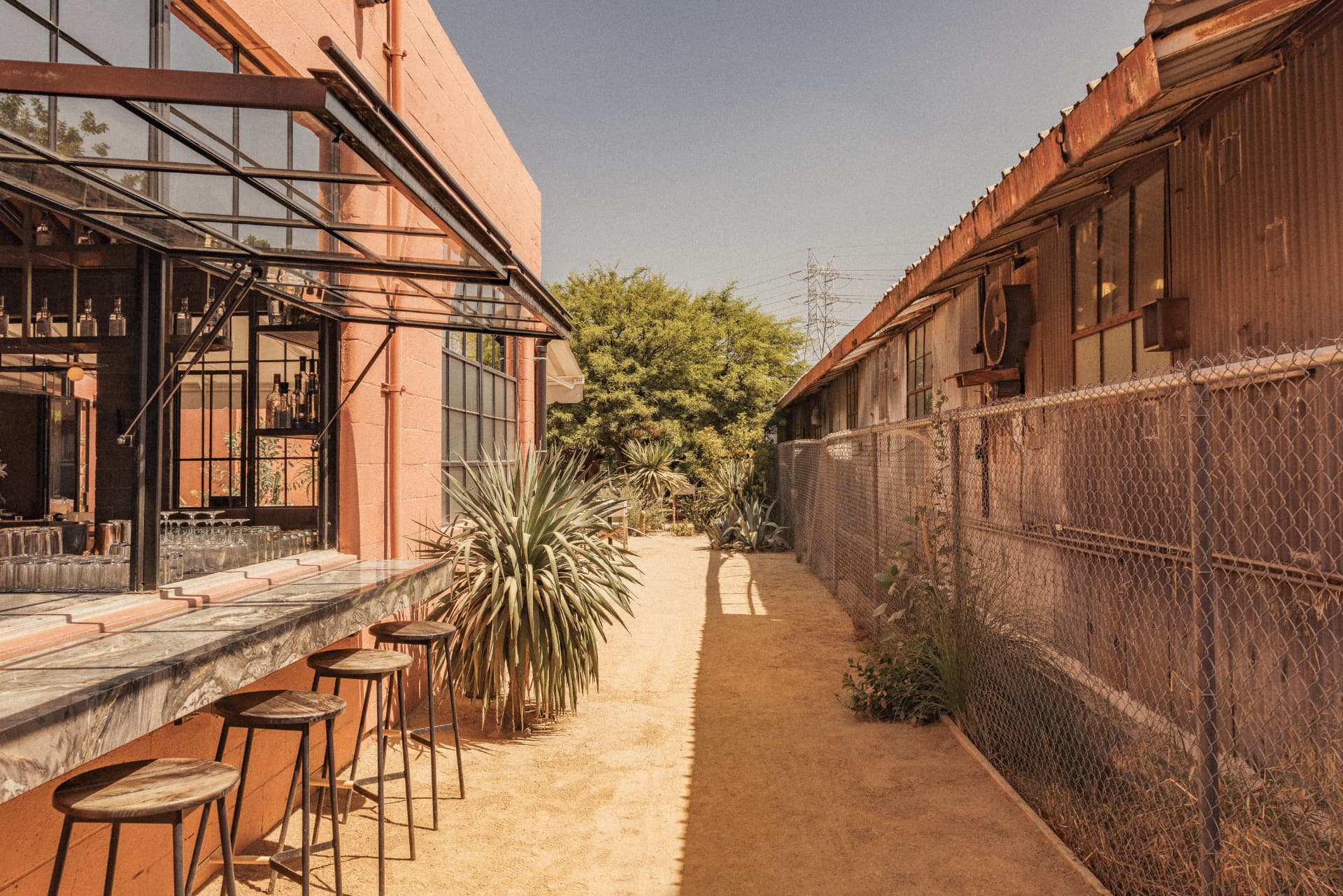 Sunlit outdoor bar and sand patio at Mariscos Za Za Zá