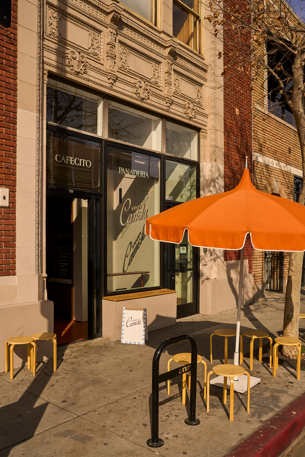 Santa Canela storefront with orange umbrella